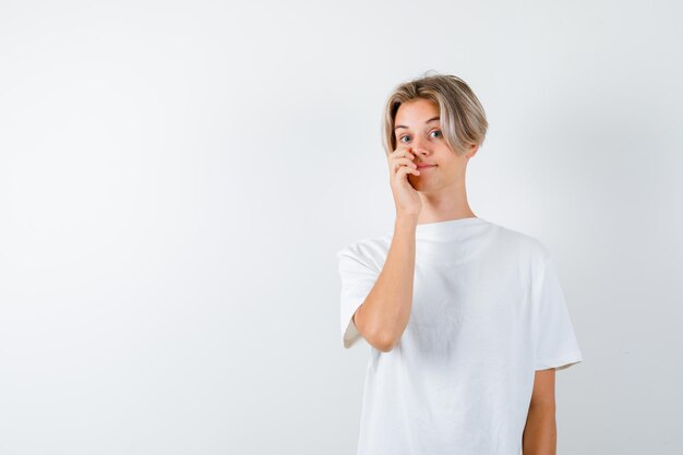 Handsome teen boy in a white t-shirt