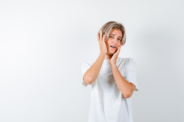 Handsome teen boy in a white t-shirt