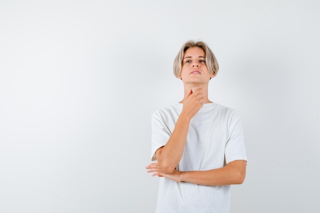 Handsome teen boy in a white t-shirt