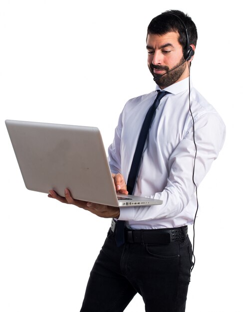 Handsome telemarketer man with laptop