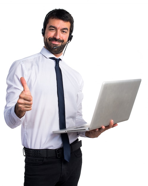 Handsome telemarketer man with thumb up