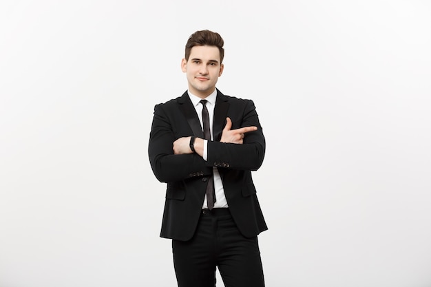 Handsome young business man happy smile point finger to empty copy space, businessman showing pointing side, concept of advertisement product, isolated over white background