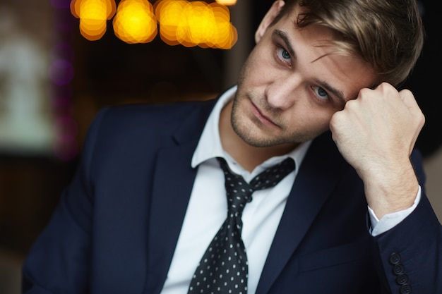 Handsome Young Businessman Looking at Camera