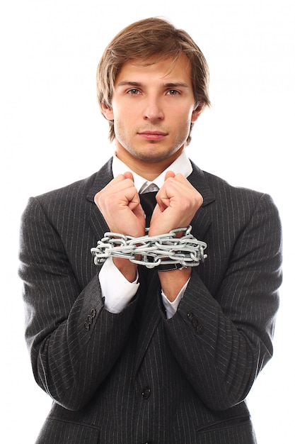 Free photo handsome young businessman portrait chained