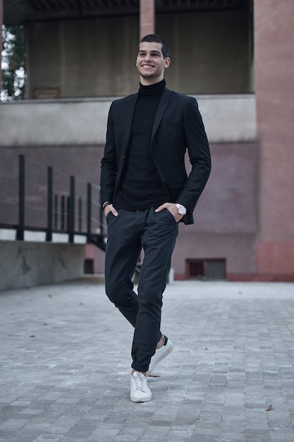 Handsome young male walking on the street