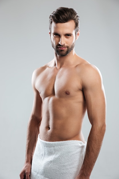 Handsome young man dressed in towel