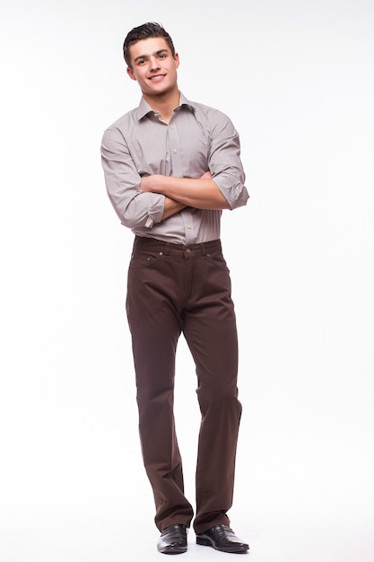 Free Photo handsome young man in shirt while standing against white wall