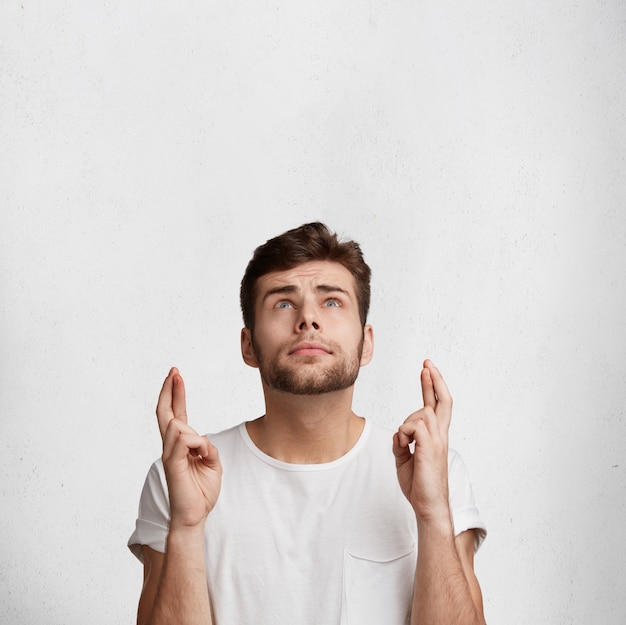 Handsome young man in white T-shirt