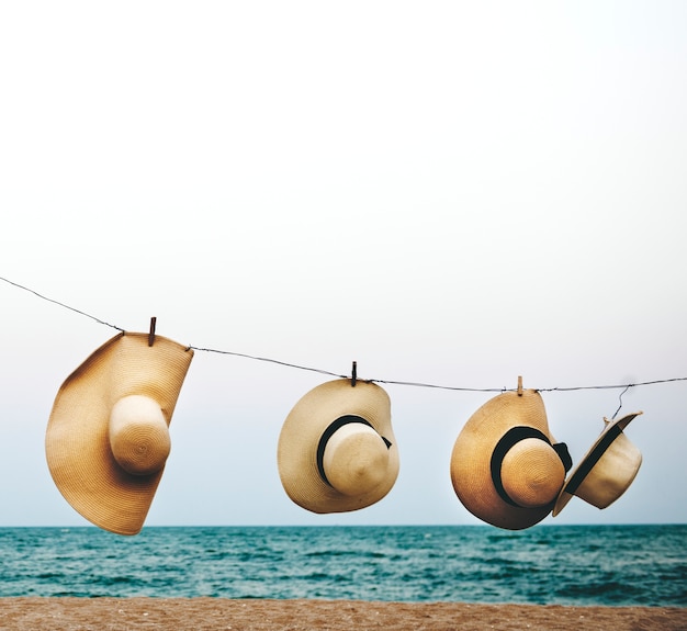 Free photo hanging hat beach coastline concept