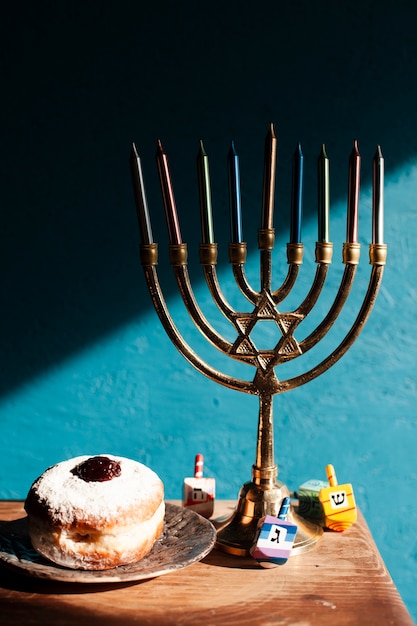 Free Photo hanukkah candlestick holder with doughnuts