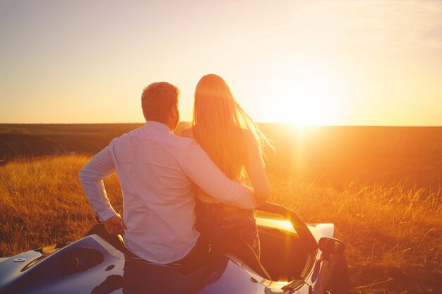 Happiness couple stay in the new sport car