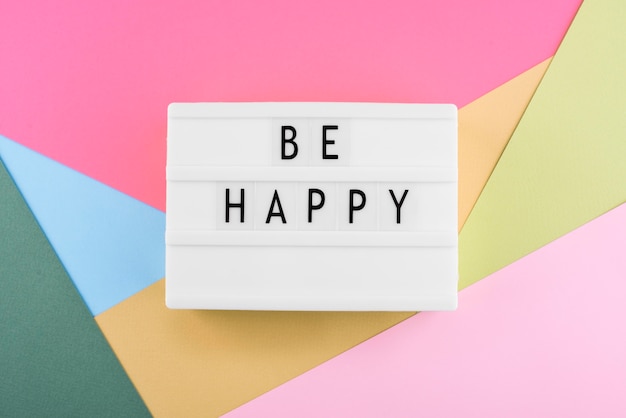 Free photo happiness message on lightbox arrangement