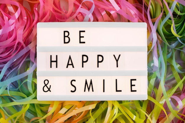 Free photo happiness message on lightbox arrangement