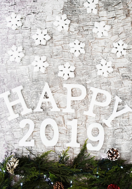 Happy 2019 inscription with branches