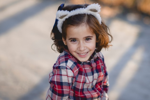 Happy adorable little girl smiling outdoors.