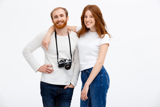 Free photo happy adult couple posing with photo camera