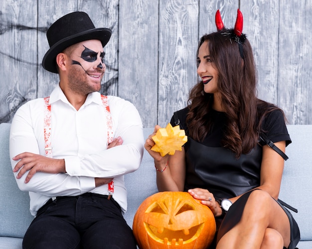 Free photo happy adult couple together for halloween