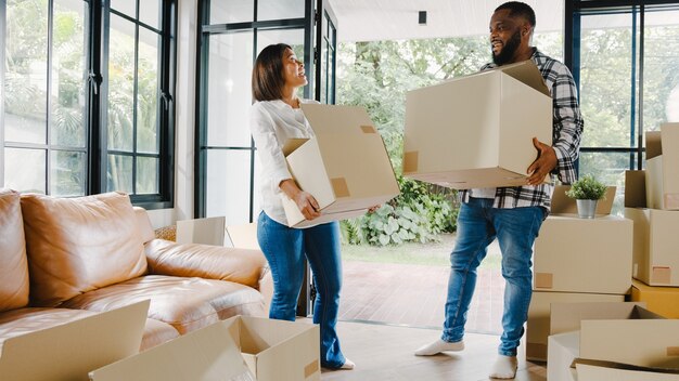 Happy African American young family bought new house.