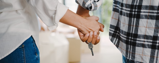 Happy African American young family bought new house.