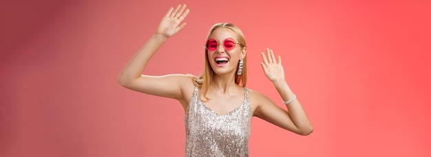 Free Photo happy amused carefree blond woman go wild dancefloor dancing having fun yelling yeah closed eyes