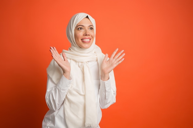 Happy arab woman in hijab. Portrait of smiling girl, posing at studio background