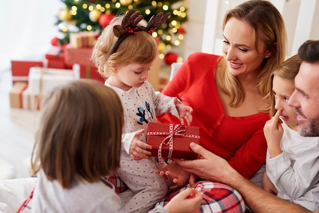 Happy baby with family in Christmas time