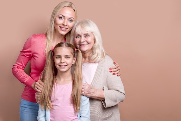 Free photo happy beautiful women holding each other