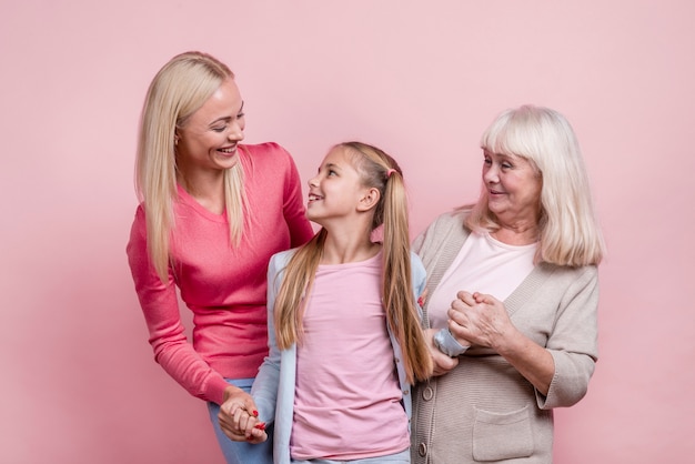 Free photo happy beautiful women looking at each other