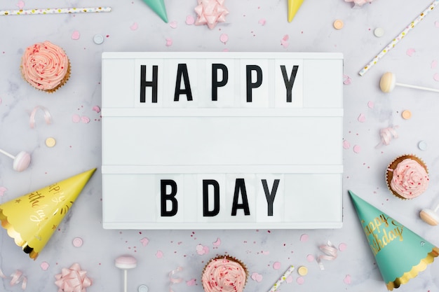 Happy birthday message with cones and cupcakes