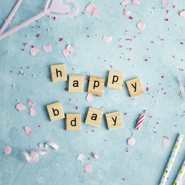 Free photo happy birthday wish in wooden letters with candles and straws