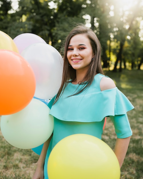 Free photo happy birthday woman holding balloons