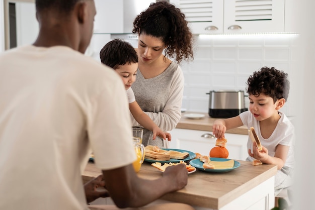 Happy black family enjoying breakfast together