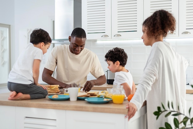 Happy black family preparing food