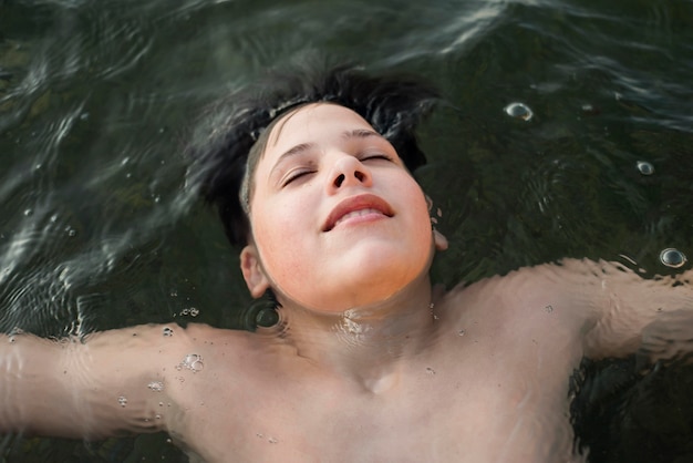 Happy boy swimming in the sea