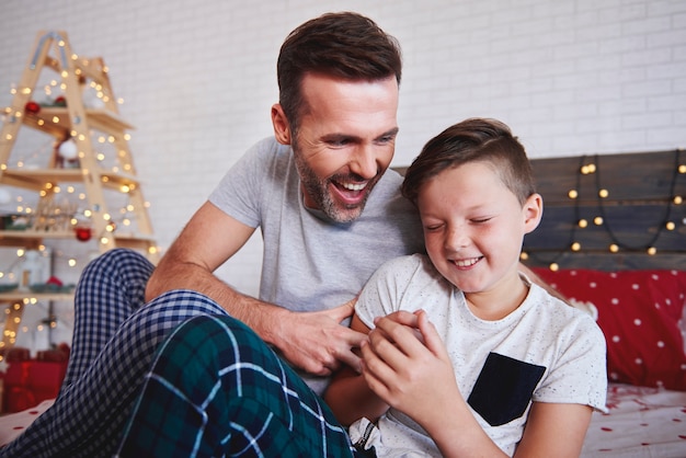 Free photo happy boy with father in christmas time