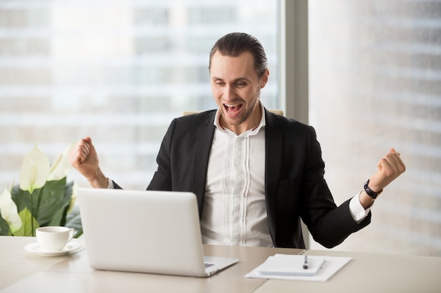 Free Photo happy businessman excited because of success