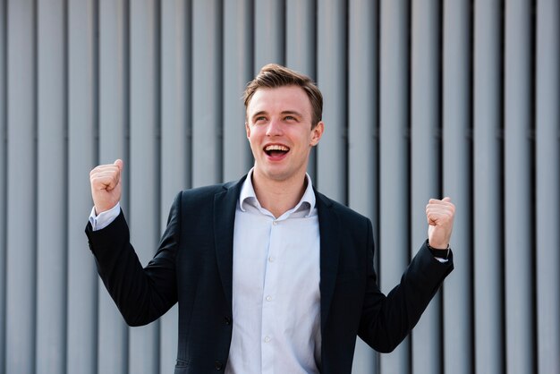 Happy businessman looking away