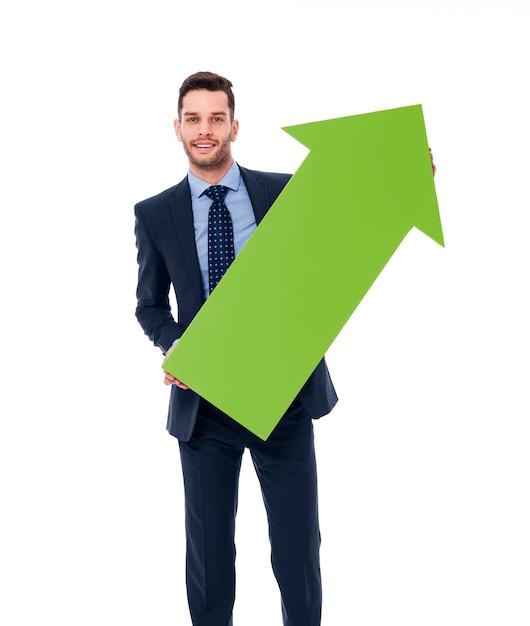 Free photo happy businessman with a green arrow