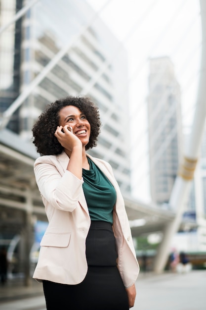 Happy businesswoman talking on the phone