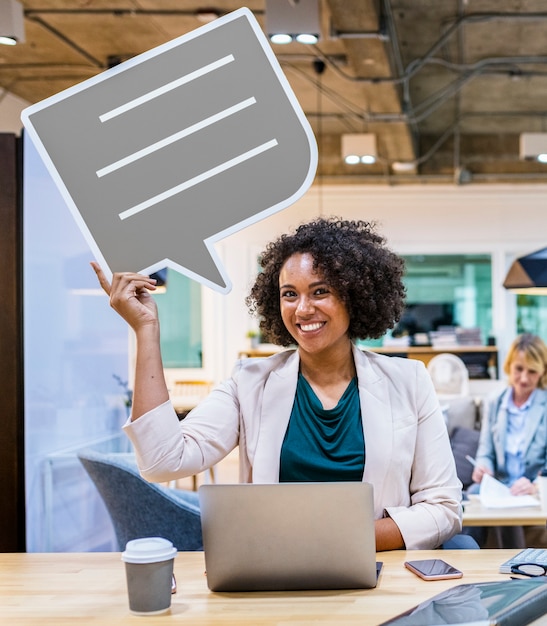 Happy businesswoman with speech bubble