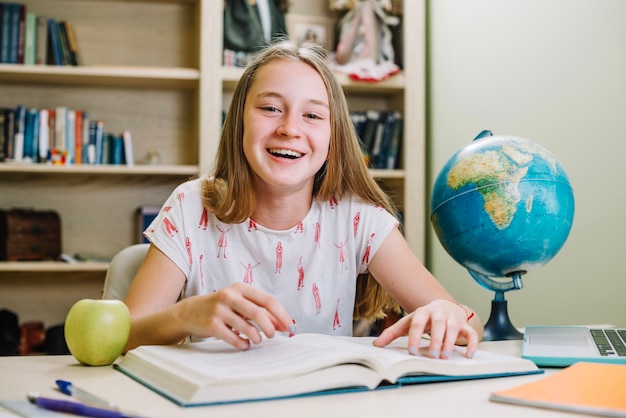 Happy casual girl with book