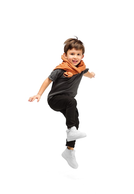 Happy caucasian little boy isolated on white studio background Looks happy cheerful sincere Copyspace Childhood education emotions concept