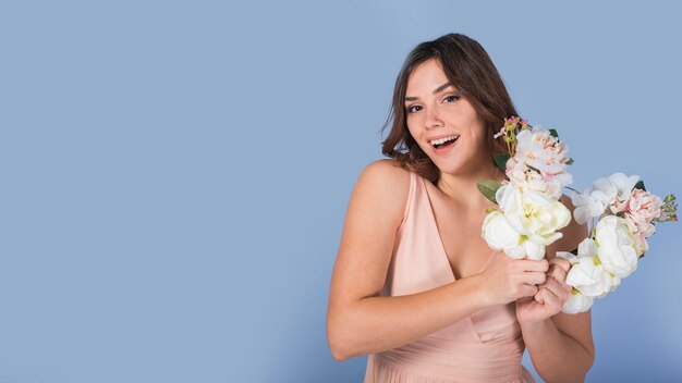 Happy charming lady with white flowers