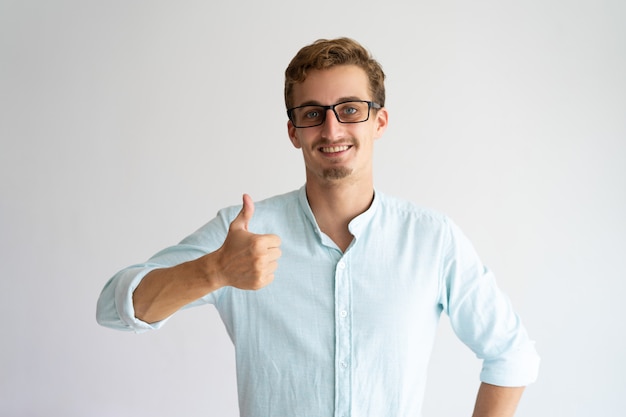 Free Photo happy cheerful guy in glasses expressing approval. 