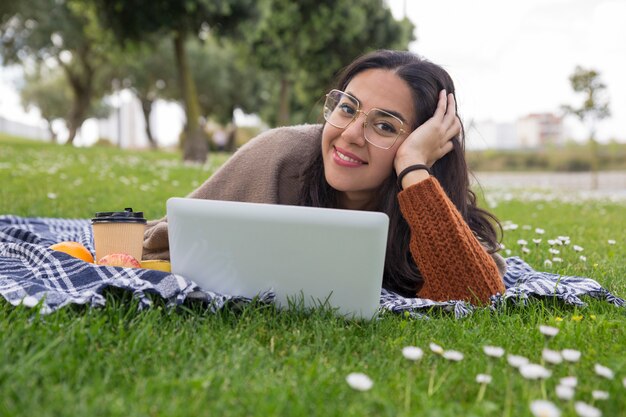 Happy cheerful student girl studying up for class