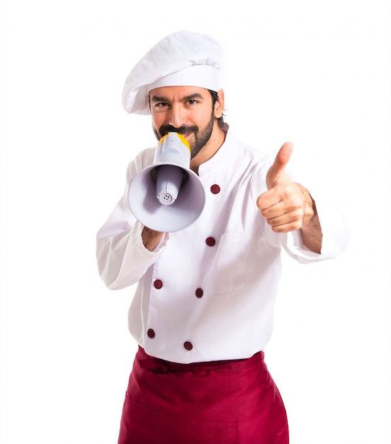 Happy chef shouting by megaphone