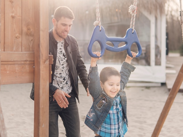 Free photo happy child and father moments on the playground