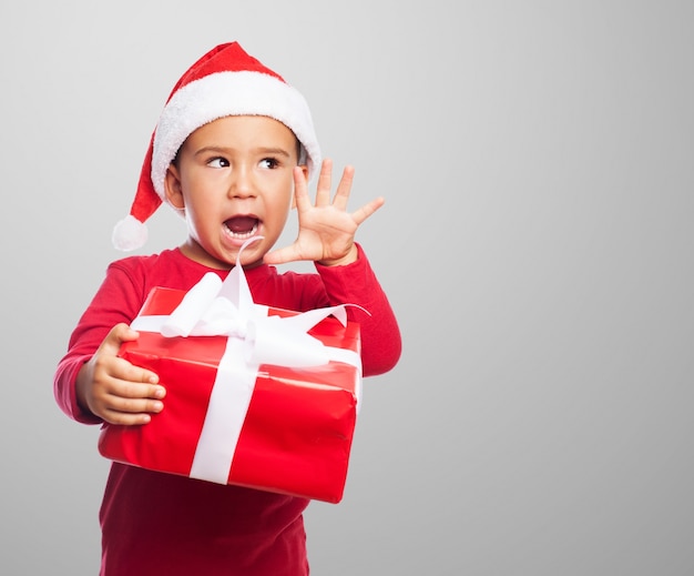 Happy child showing his gift box