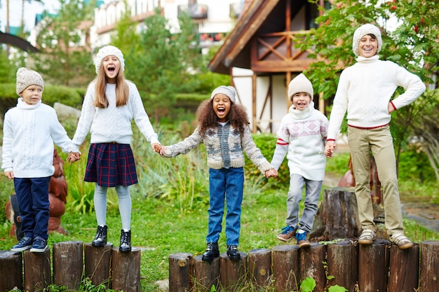 Happy Children Playing Outdoors and Screaming