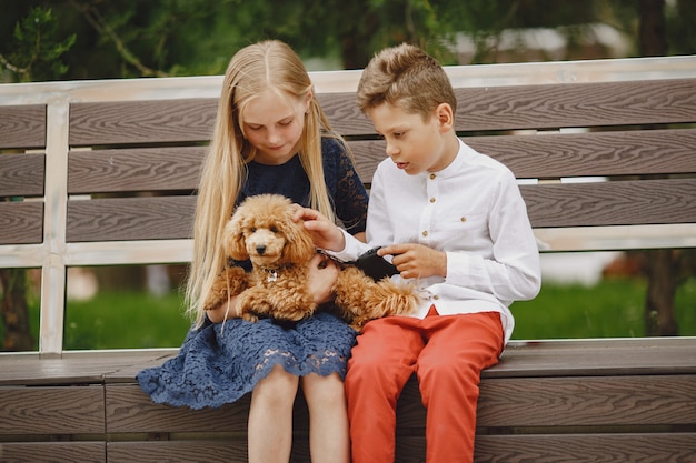 Free photo happy children sitting together close and smile